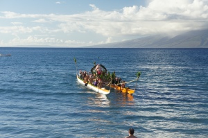 Santa nearing Maui by canoe
